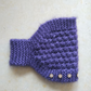 Strickstirnband für Damen mit Blumenakzenten